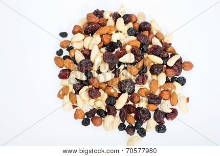 mixed nuts and dried fruits isolated on white background