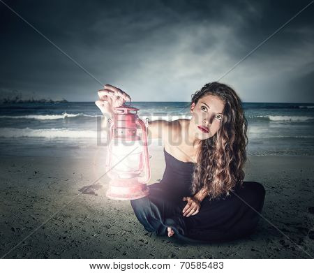 young woman illuminating the night with a lantern