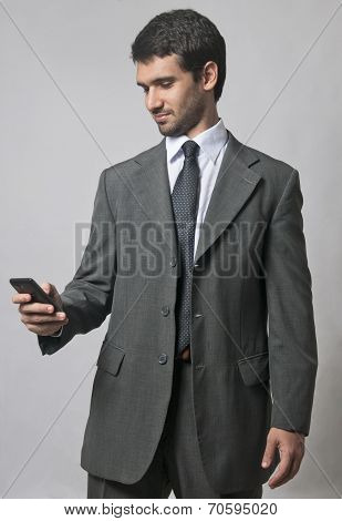Businessman Using a Cellphone - Isolated