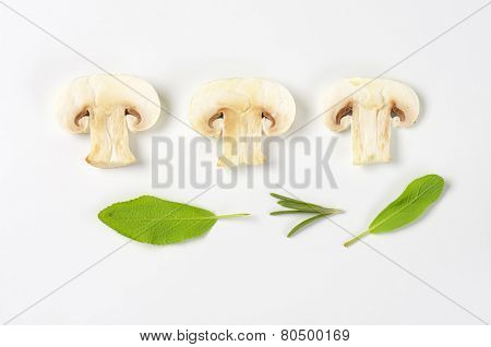 three this slices of white mushroom with sage and rosemary
