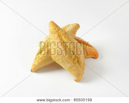 portion of three plain bread rolls