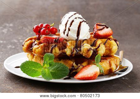 Belgian waffles with berries (currants, strawberries) and ice cream