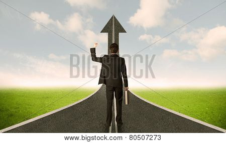 Businessman lokking at 3d road upgoing arrow concept