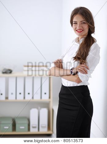Attractive businesswoman with her arms crossed stnding