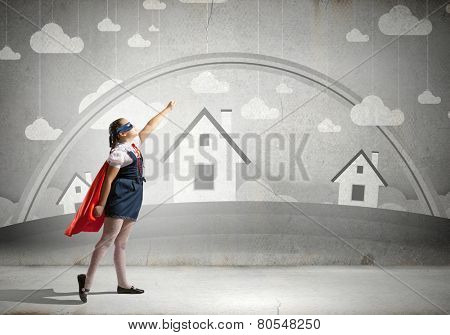 Girl of school age in super hero costume