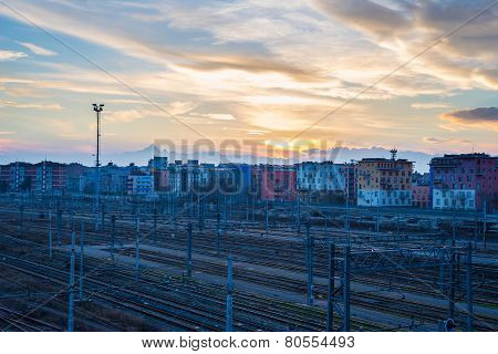 Blurred Cityscape Beyond Metal Fence