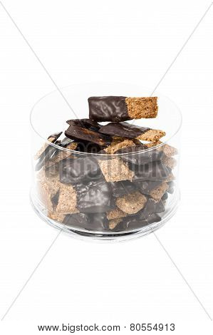 Cookies Halfway Into Chocolate Glaze In Glass Container