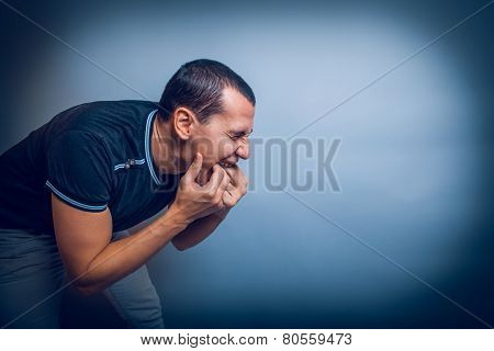 man of European appearance brunet shoved his fingers