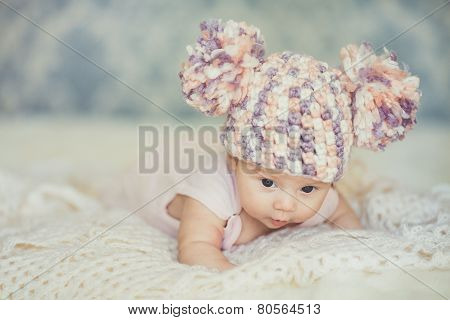 Happy little girl in cap bear