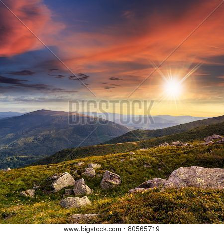 Mountain Hillside With White Boulders At Sunset