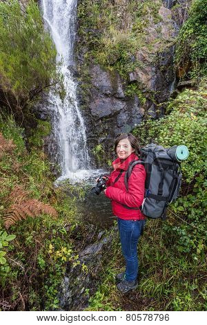 Girl Tourist Photographs Waterfall. Portugal Monchique, Chilrao.