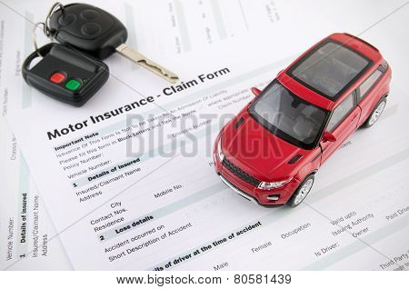 Car Toy And Keys On Insurance Documents . Protection Car Concept