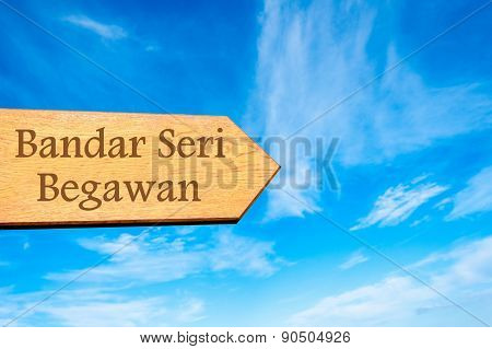 Blank Wooden Arrow Over Clear Blue Sky With Copy Space