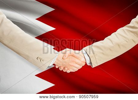 Businessmen Handshake With Flag On Background - Bahrain
