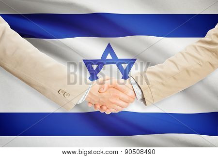 Businessmen Handshake With Flag On Background - Israel