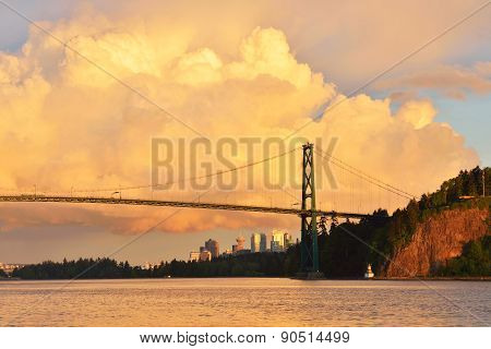 Lions Gate Bridge And Downtown Vancouver With Spectacular Clouds At Sunset