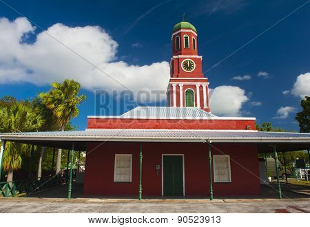 Famous red clock tower on the main guardhouse at the Garrison Savannah. UNESCO garrison historic area Bridgetown, Barbados