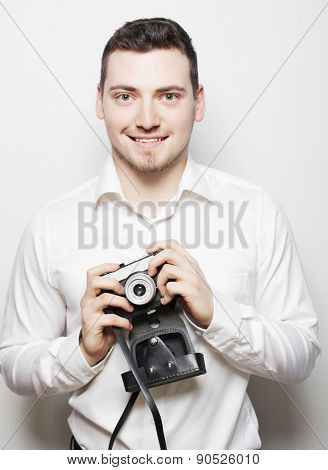 technology, people and life style concept: young  photographer over white background