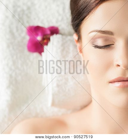 Young, beautiful and healthy woman in spa salon. Traditional oriental massage therapy and beauty treatments. 