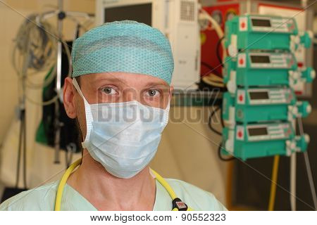 Portrait Of  Male Nurse Icu  In A Green Uniform.