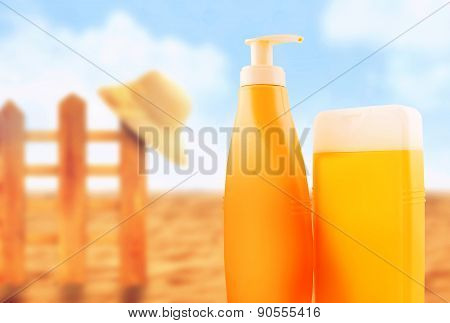 Suntan Lotion Bottles On Sunny Beach