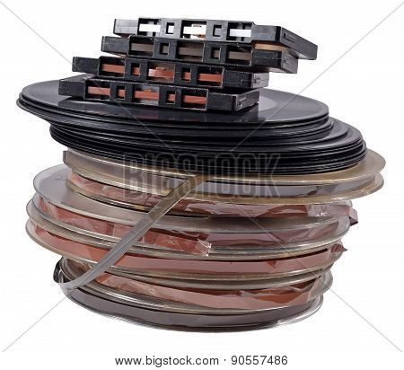 Old Vintage Bobbins, Vinyl Records And Cassette Tapes On A White