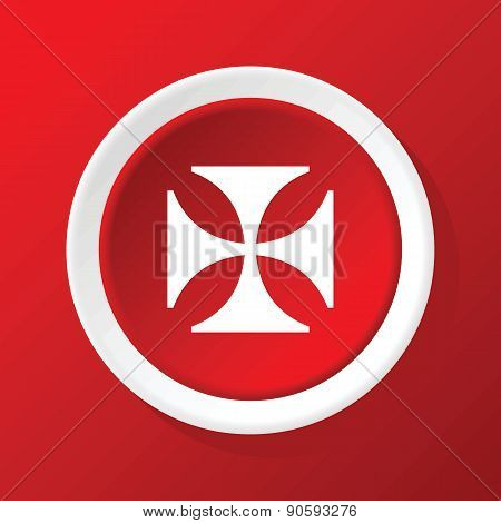 Maltese cross icon on red