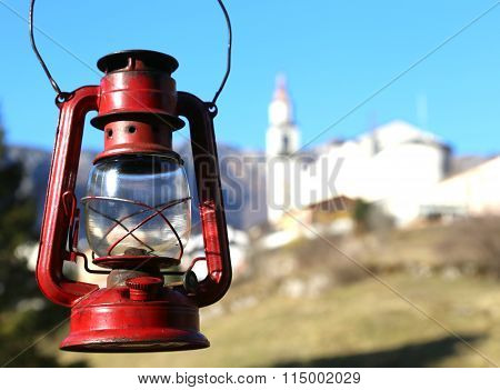 Vintage Red Lantern Near The Small Village Amid The Mountains