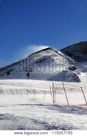 Gondola Lift On Ski Resort At Windy Sun Day