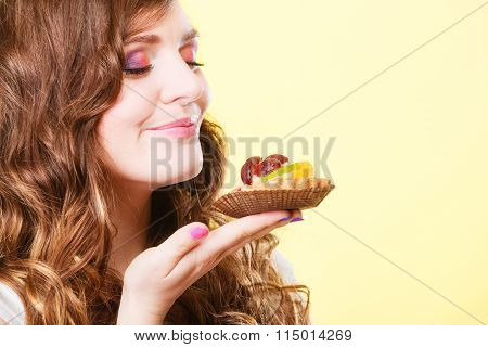 Woman Closed Eyes Holds Cake In Hand