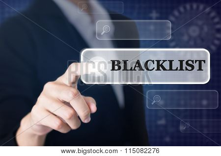 Businessman pressing a BLACKLIST concept button.