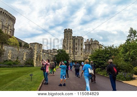 Unidentified Tourists Near Medieval Buildings Inside Windsor Castle