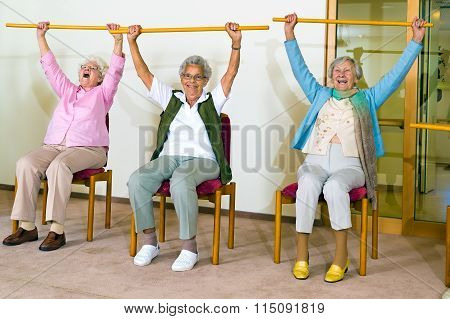 Three Happy Elderly Ladies Doing Exercises
