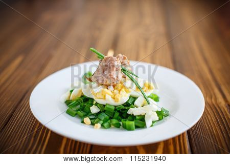 salad with cod liver oil, eggs and green onion
