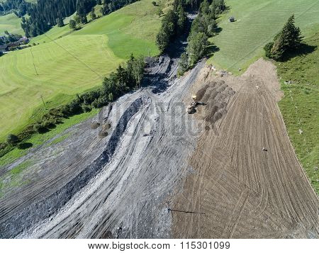 Men And Equipment Cleaning Up After The Mudslides