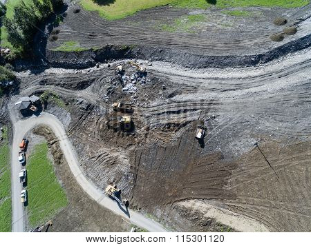 Men And Equipment Cleaning Up After The Mudslides