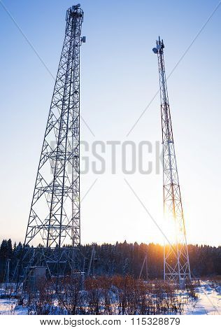 two telecommunications towers in a shot entirely