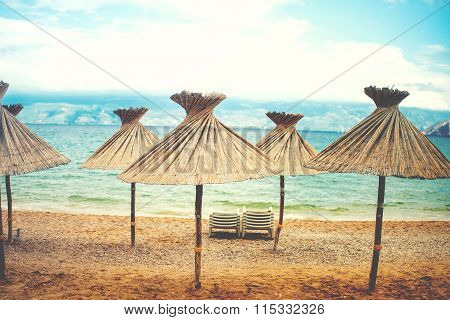 Instragram Retro Effect On Photo, Beach Umrellas With Straws And Shade On Beach, Coastline Landscape