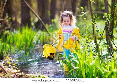 Little girl catching a frog