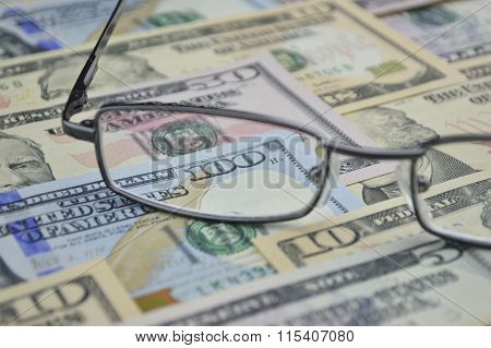 Glasses And Dollar Bank Note Money; Financial Concept