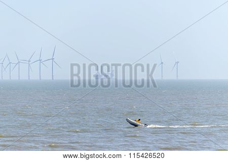 speed boat an offshore wind farm