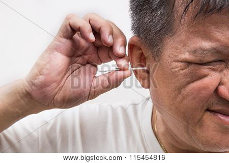 Man Cleaning Ear With Cotton Buds Stick With Ticklish Expression