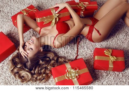 Sexy Beautiful Woman With Blond Curly Hair In Lingerie With Presents