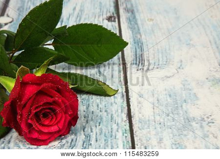 Red Rose On Wooden Background With Vintage Effect