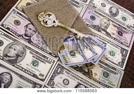 Banknotes Hundred Dollars, Burlap And Key.