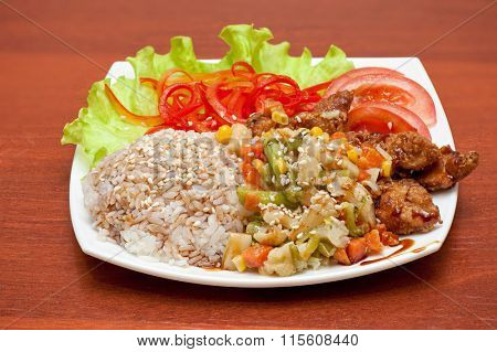 plate of chinese rice with roasted meat and vegetables