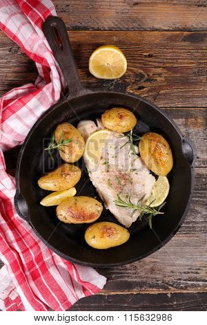 fish fillet and roasted potatoes