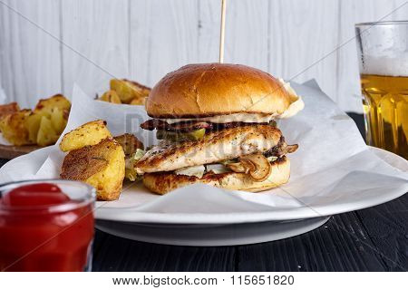 Burger with ketchup on wooden background