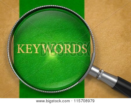 Keywords through Loupe on Old Paper.