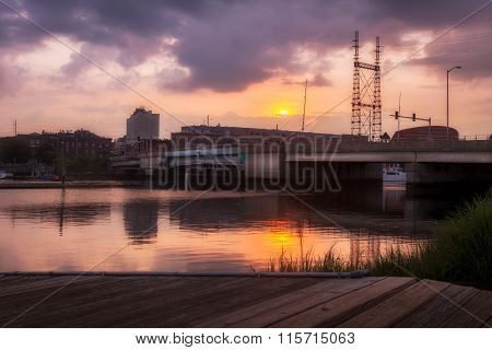 Bridge Over Calm Water At Sunset
